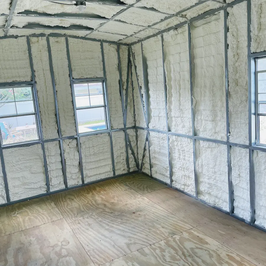 Closed-cell spray foam insulation applied to wall cavities in a residential project in Tiffin
